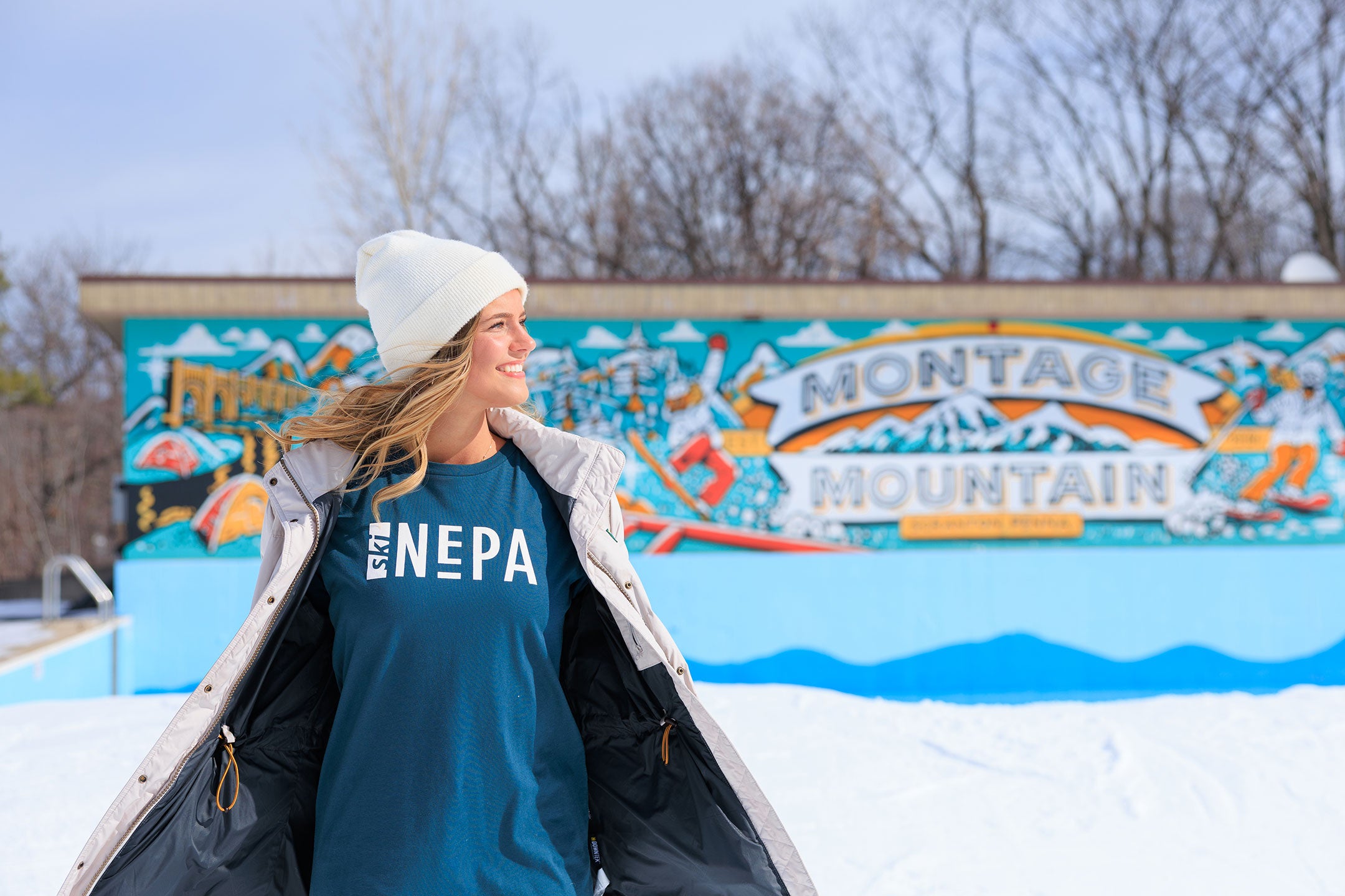 Woman wearing Atlantic Ski NEPA Long Sleeve at Montage Mountain Resorts in Scranton, PA.