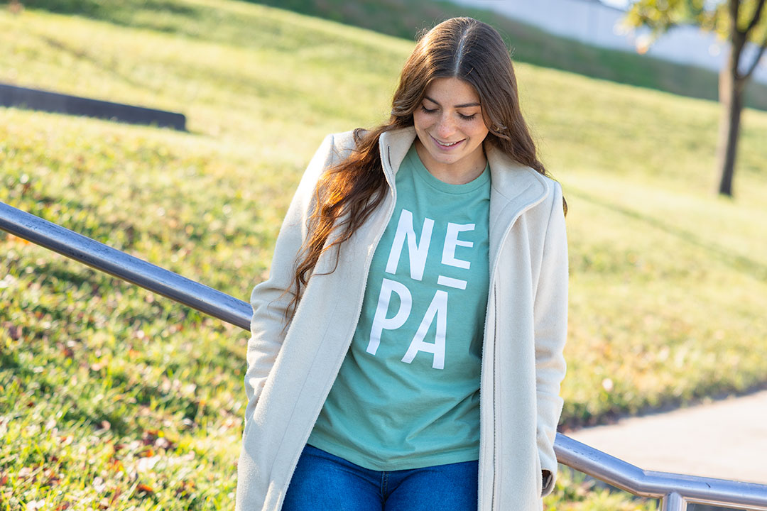 Model wearing NEPA Women's Sage Stacked Tee